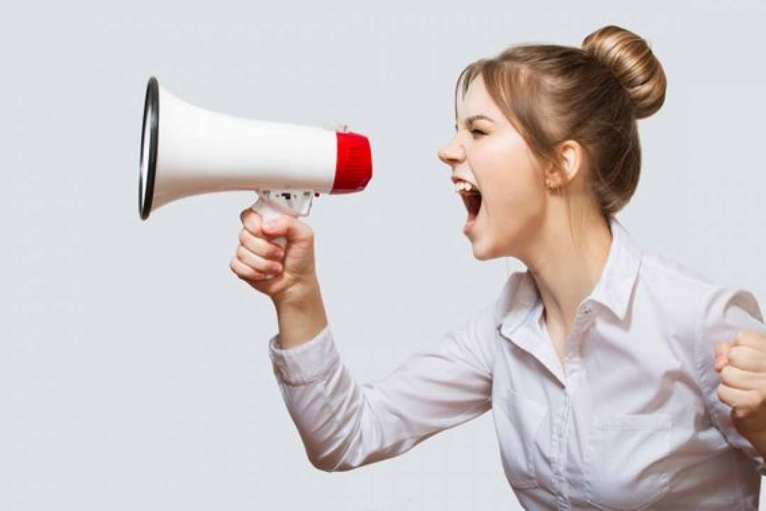 woman screaming into a megaphone